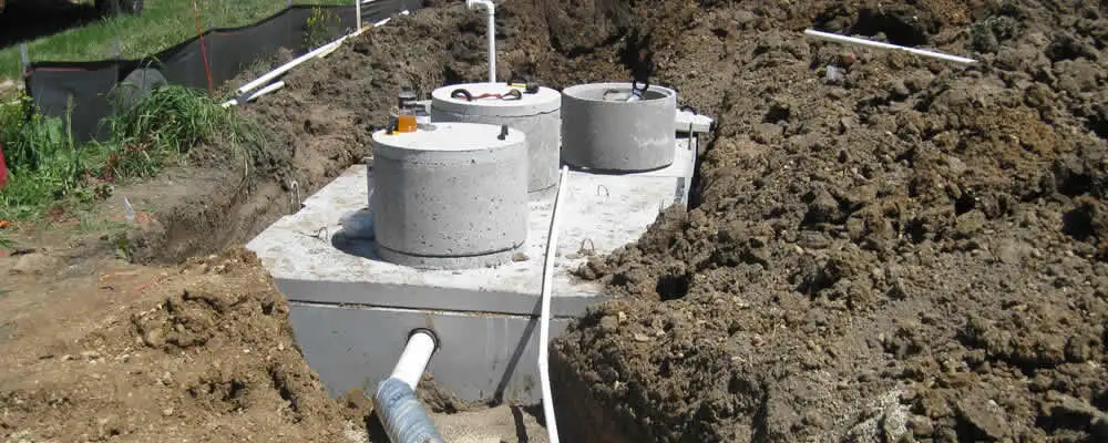 Septic system repair and installation site with tank access ports in Miami, FL