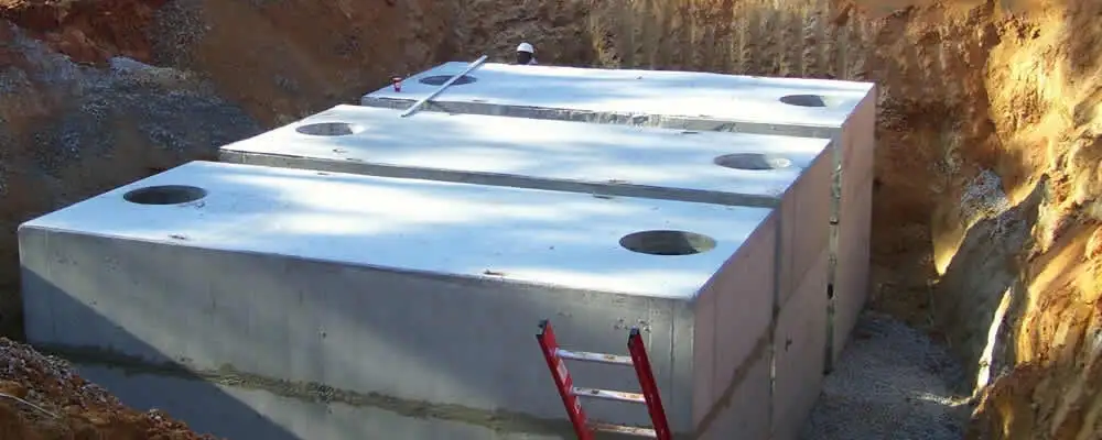 Septic tank installation site with a newly placed concrete tank in Miami, FL